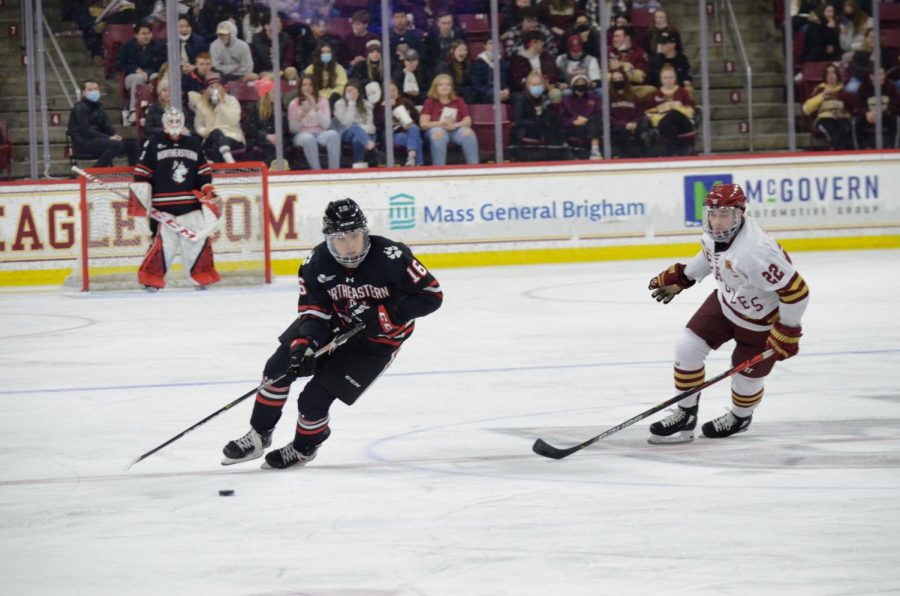 Sam Colangelo takes the puck up the ice and away from the Northeastern goal. 