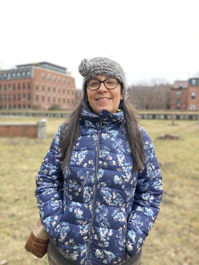 Kelly Thomas stands at the center of South End Burying Ground. Thomas is responsible for the preservation of 15 other cemeteries throughout Boston. Photo credit Kate Armanini.