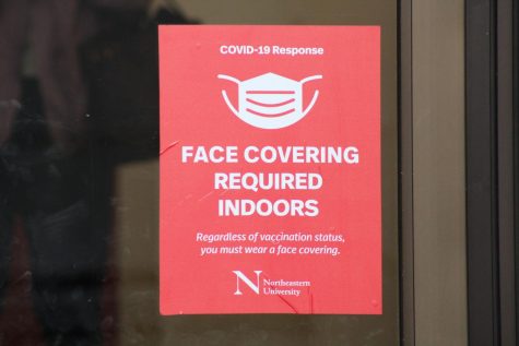 A face covering requirement at Cabot Testing Center. Northeastern announced it is evaluating its mask mandate Friday.