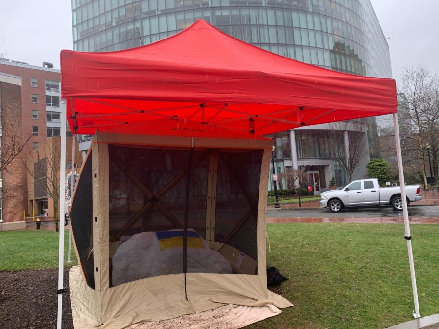 The ‘spray paint rock,’ outside of Ryder Hall, was covered with pop-up tents on Wednesday morning to protect the Ukrainian flag painted on it. 
