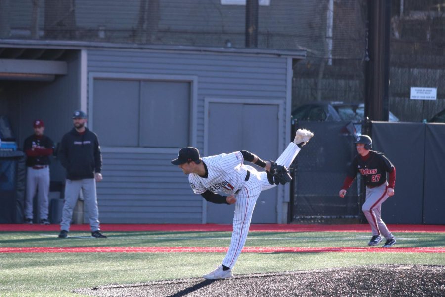 Eric Yost, sophomore right hand pitcher, pitches in a game at Friedman Diamond. Northeastern University baseball’s record continues to split the rail with an even 17-15-1.
