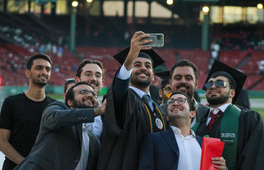 Newly graduated students take a selfie as they exit Fenway Park. 