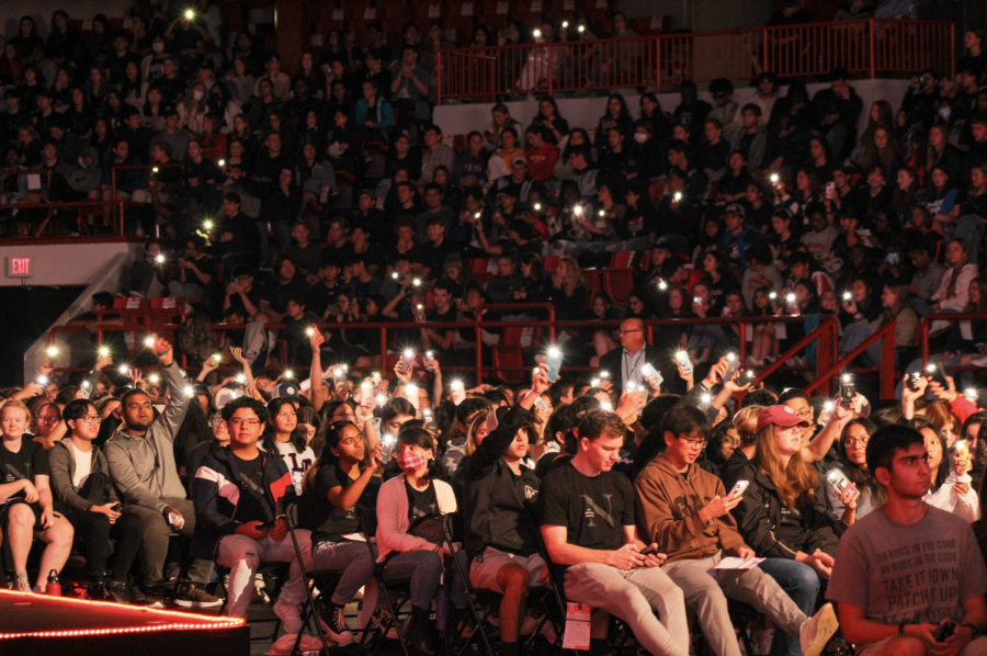 Students shine their phone flashlights during the ceremony. Twice during the ceremony, students participated in a flashy light show.