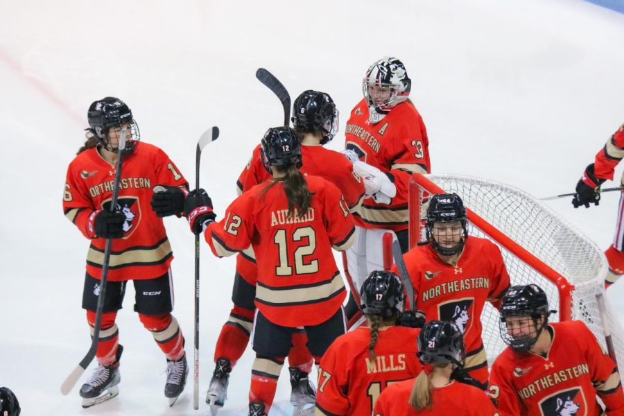 The womens hockey team gets ready to play before the 2022 Beanpot Tournament
