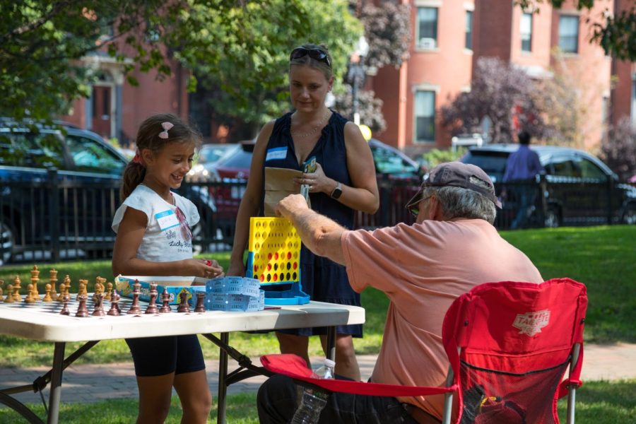 The Mass Ave Coalition welcomes residents to Chester Square Park for
the Fall Festival. Events at the festival included games and jazz music. Photo courtesy of Moli Luo.