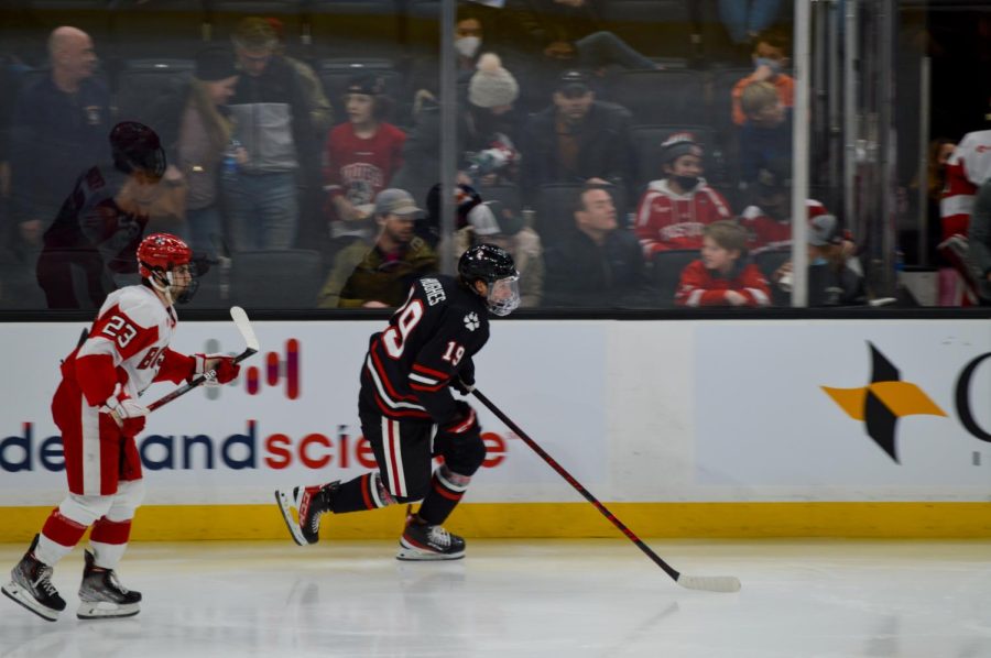 Riley Hughes races to beat Boston University to the puck at the Beanpot finals Feb. 14.