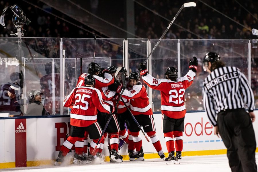 Northeasterns+mens+hockey+team+rejoices+after+a+goal+scored+during+Frozen+Fenway.+Northeastern+came+away+with+a+4-1+win+over+the+University+of+Connecticut.