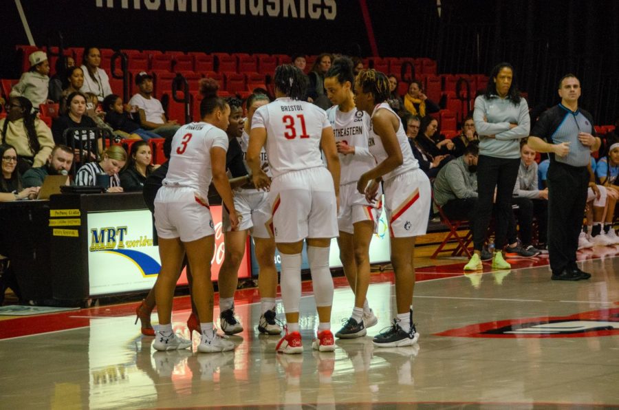 Northeastern%E2%80%99s+women%E2%80%99s+basketball+team+huddles+during+a+game.+After+Sunday%E2%80%99s+matchup+against+Monmouth+University%2C+the+Huskies%E2%80%99+season+record+sits+at+10-9.