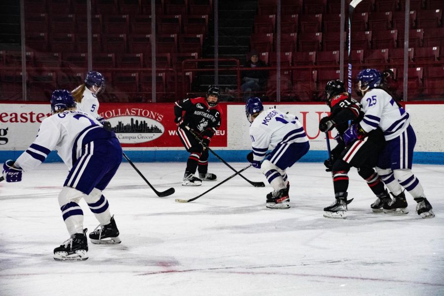 Graduate student forward Alina Mueller faces the Holy Cross Crusaders on the ice. Mueller’s game-winning goal, her 168th career point, broke the all-time scoring record for Hockey East.