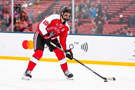 Graduate student forward Jakov Novak on ice at Frozen Fenway January 7. Novak has nine points this season, including seven goals and two assists. 