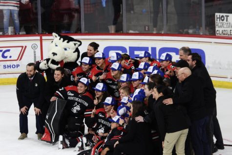 The Northeastern womens hockey team gathers for a photo after winning its 18th Beanpot. The Huskies defeated Boston College 2-1 on Valentines Day to claim the title.