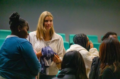 Members of the NU Fashion Society exchange clothes in an IV classroom Jan. 24. The club held a clothing swap during its second meeting of the semester to promote sustainability while updating ones wardrobe.