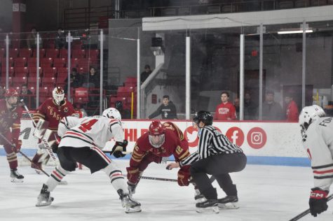 Graduate student forward takes a faceoff against Boston College. Walsh extended his five-game point streak with an assist in Tuesday night’s game.