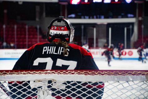 Senior netminder Gwyneth Phillips looks on from the net during the game against Holy Cross Jan. 27. Philips made 16 saves against the Crusaders and earned her ninth shutout of the season.