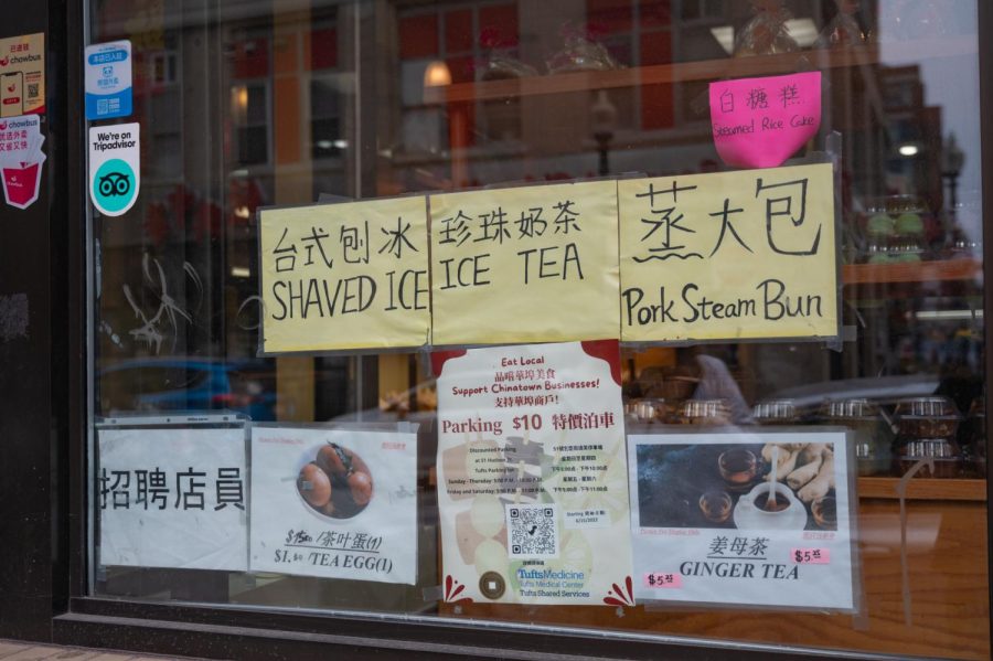 Paper signs taped to the front window of Taiwan Bakery advertise some of the foods that the store has for sale. The shop has earned a reputation for having delicious tea eggs.