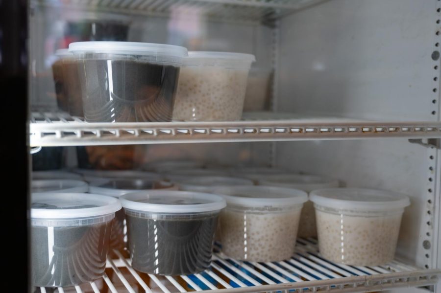 Takeout containers of taro sago are in a refrigerator near the register. The dessert has been traditionally made from coconut milk, taro and sago pearls.