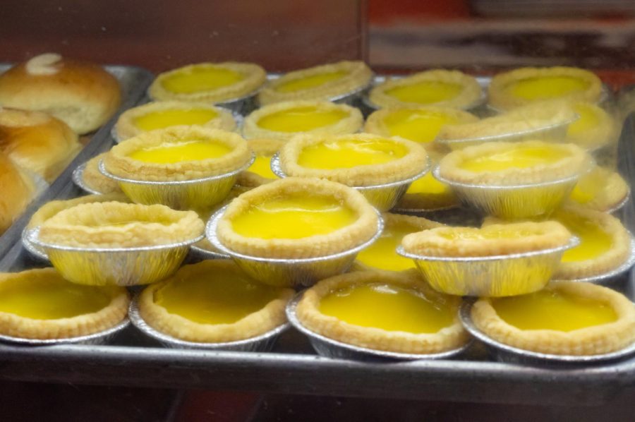 Egg tarts sit on display inside Ho Yuen Bakery. The stacked pastries have long been a customer favorite.