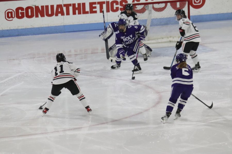 Graduate student forward and captain Alina Mueller takes aim during a game against Holy Cross. Mueller was named Hockey East Player of the Year this season and is a top-3 finalist for the Patty Kazmaier Award. 