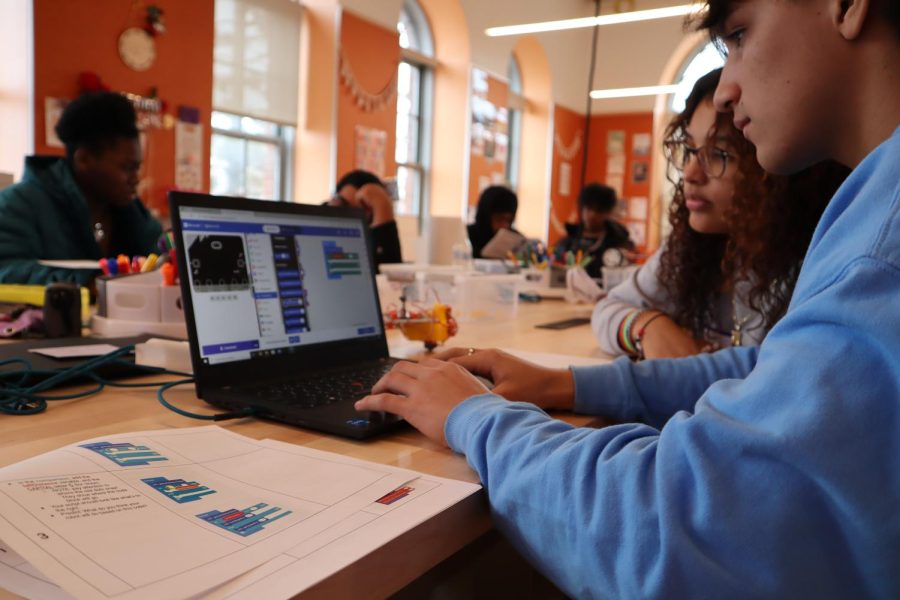 Two members of The Possible Zone work together on a digital project. The organization has given lower-income students in Boston the opportunity to build their own entrepreneurial projects through the course of a four semester program. Photo courtesy The Possible Zone. 