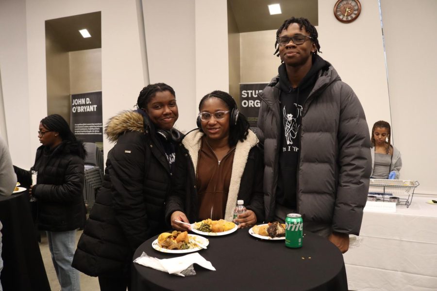 A group of students gather around a table while sampling different dishes from across the diaspora. The event aimed to showcase the cultural significance of food in African diaspora cultures.