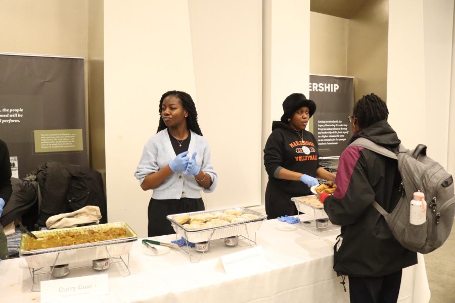 A student surveys the selection of Caribbean food offered at Taste of the Diaspora. Food has always been important in Caribbean culture, with many families having their own variations of common dishes.