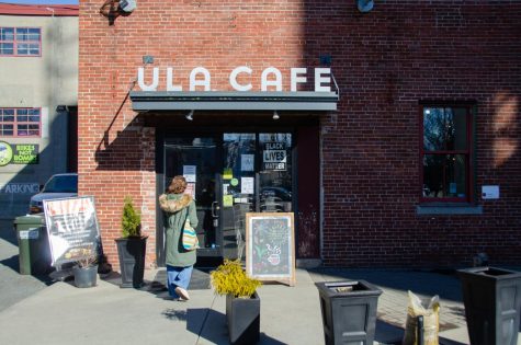 A customer walks into Ula Café, located at 284 Amory St. in Jamaica Plain. Customers have been drawn into the cafe for its locally-sourced ingredients and commitment to social responsibility.