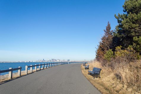 A road winds around the edge of Deer Island. The island, one of 34 in the Boston Harbor Islands National and State Park, has been an ideal getaway location, with ample space to take a relaxing walk or to simply enjoy the fantastic views.