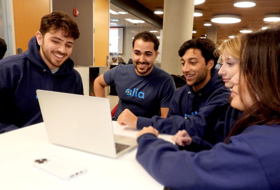 Members of the Alia team look at their website. Student founders Cory Gill and Shaan Arora hoped to grow the business into the future of online shopping. Photo courtesy Shaan Arora.