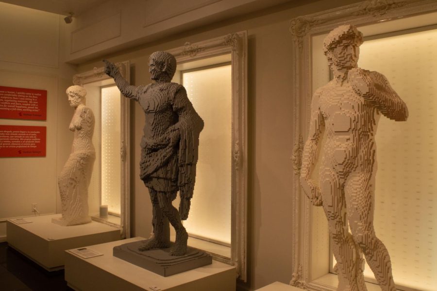 Three famous historical sculptures stand in a row, cast in Lego instead of marble: Michelangelos David, an unknown artists Augustus of Prima Porta and Venus de Milo, also of unknown origin (right to left). Sawaya used the toy bricks to make classical art more appealing to younger generations.