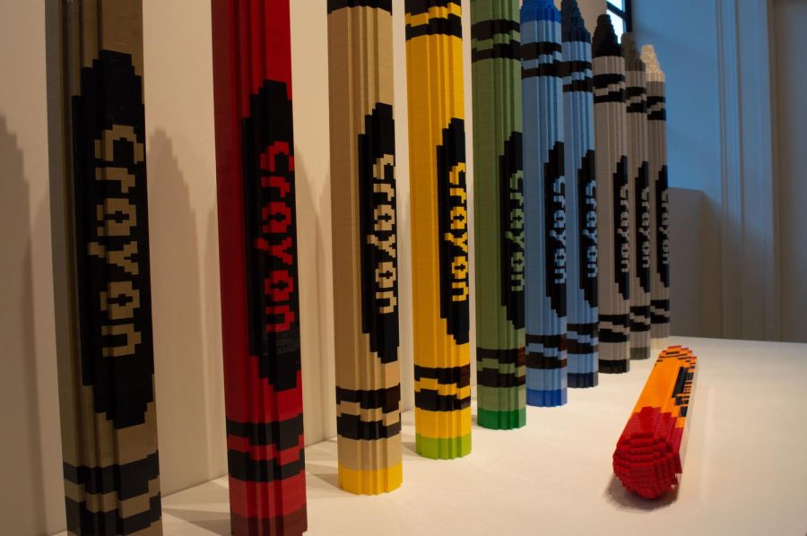 Ten Lego crayons stand in a row, while an eleventh lies on its side. Sawaya played with scale and presentation to add meaning to a typically innocent and childlike object.
