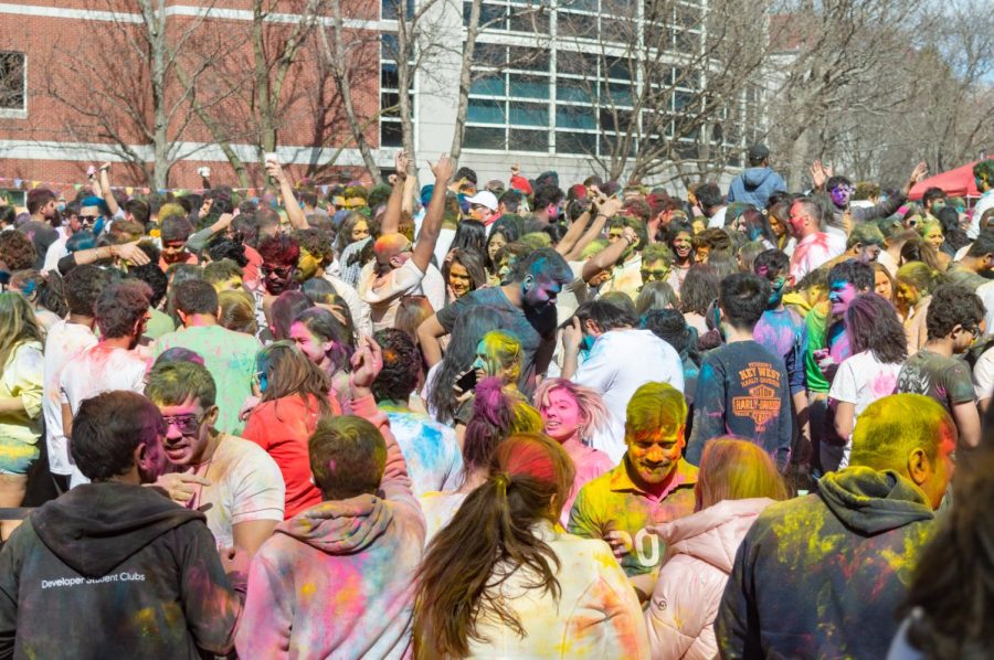 Attendees dance to music from across India while throwing colors at each other. While some groups were made up of friends, Holi provided many an opportunity to meet new people and connect over the festivities.