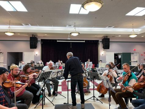 Ronald Braunstein conducts the Me2/ community orchestra. Braunstein and his wife founded the ensemble as a stigma-free zone to support those struggling with mental illness. 