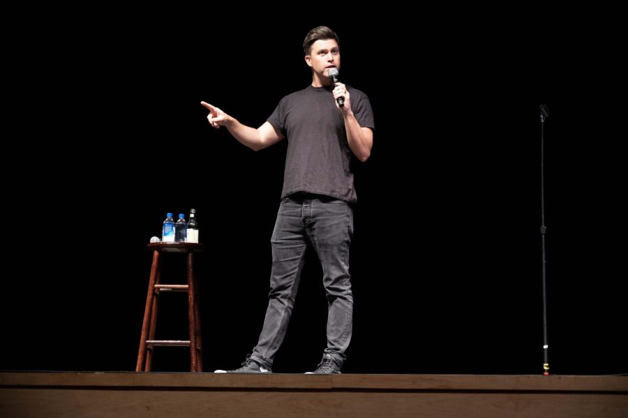 Colin+Jost+performs+onstage+in+Blackman+Auditorium+March+28.+The+SNL+cast+member+joked+about+Northeastern+beating+out+Harvard%2C+his+alma+mater%2C+during+the+Beanpot.