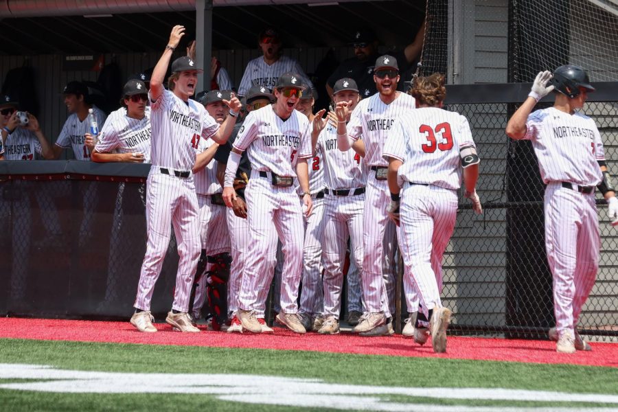 The Huskies celebrate as graduate student first baseman Tyler MacGregor runs home. MacGregor tallied one run, two hits, and one RBI in the Huskies win over William & Mary.
