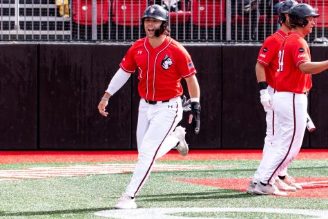 Redshirt senior utility player Danny Crossen celebrates as he runs home to score for the Huskies. In Tuesdays game against UMass Lowell, Crossen tallied his 40th RBI of the season.