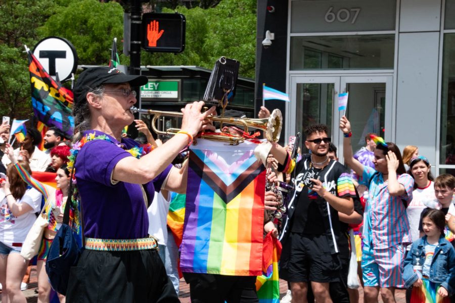 A member of the Freedom Trail Marching Band plays a trumpet with the progress pride flag attached. The Freedom Trail Marching Band also performed at Fenway Health’s AIDS Walk June 5.
