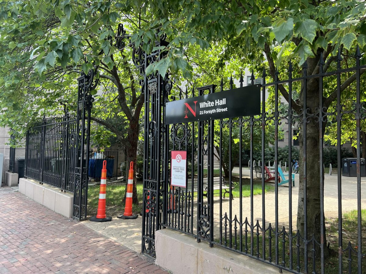 The gated entrance to White Hall stands at 21 Forsyth St. The residence hall has been shut down indefinitely after structural engineers found water damage to the buildings interior and exterior brick. 