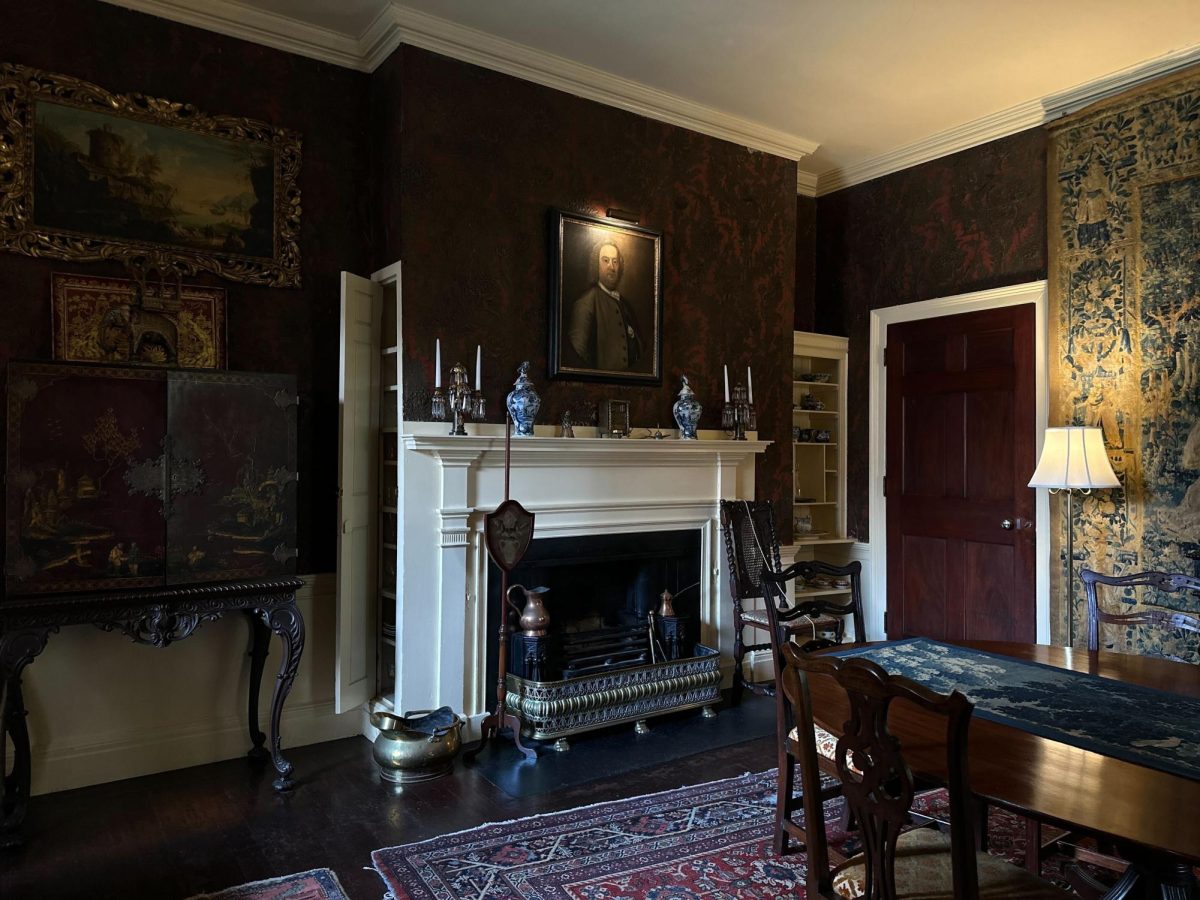 A portrait hangs above the fireplace in the Nichols House. Located in Beacon Hill, the museum was created in order to showcase 19th and 20th century history in Boston.