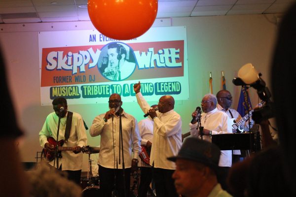 The Spiritual Encouragers, a seven-piece gospel group, finish their last song, swaying to a close. Groups performed gospel, soul, rhythm and blues for a packed venue.
