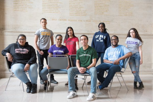 Former students of Minds Matter Boston pose for a photo wearing apparel from the colleges they have committed to. The organization has provided low-income students with college preparation assistance and resources since 2003. Photo Courtesy Minds Matter Boston. 