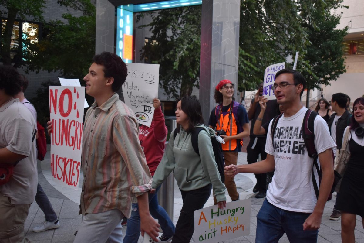 Students march through campus during the No Hungry Huskies rally. Citing Northeasterns high meal plan rates, protestors demanded more affordable dining options. Photo courtesy YDSA.