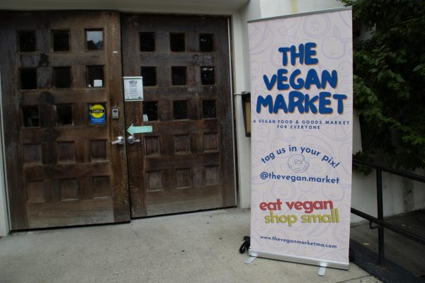A sign advertising the Vegan Market stands outside the entrance. The market was started in 2018 as a way to bring the vegan community together in a more intimate manner.