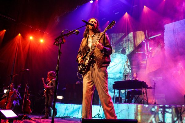 Hozier performs under the colorful lights of the set. His two night show in Boston was part of the Unreal Unearth tour. 