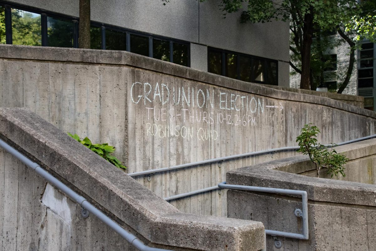 Chalk promoting the grad union election is written on the Snell Engineering wall. GENU-UAW held an election from Tuesday, Sept. 19 to Thursday, Sept. 21.