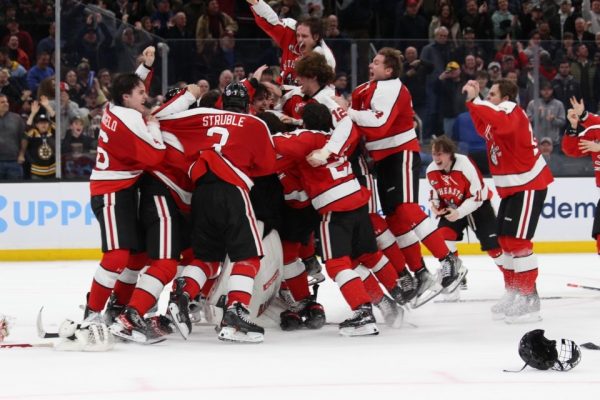 The Huskies celebrate their 2023 Beanpot win in TD Garden. Northeastern defeated Harvard in the tournament finals to claim the championship title.