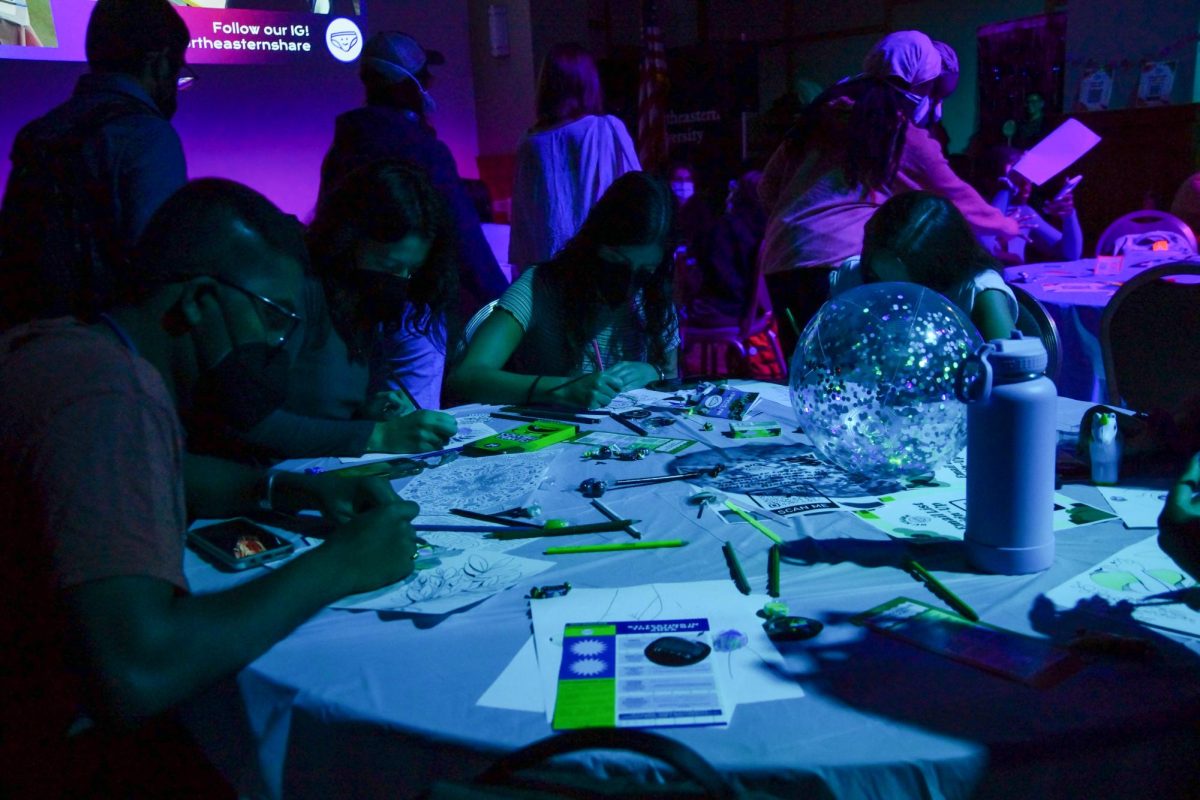 Students participate in coloring during NU SHAREs third annual pleasure party. The event was meant to celebrate all kinds of pleasure, including those outside of sex itself.