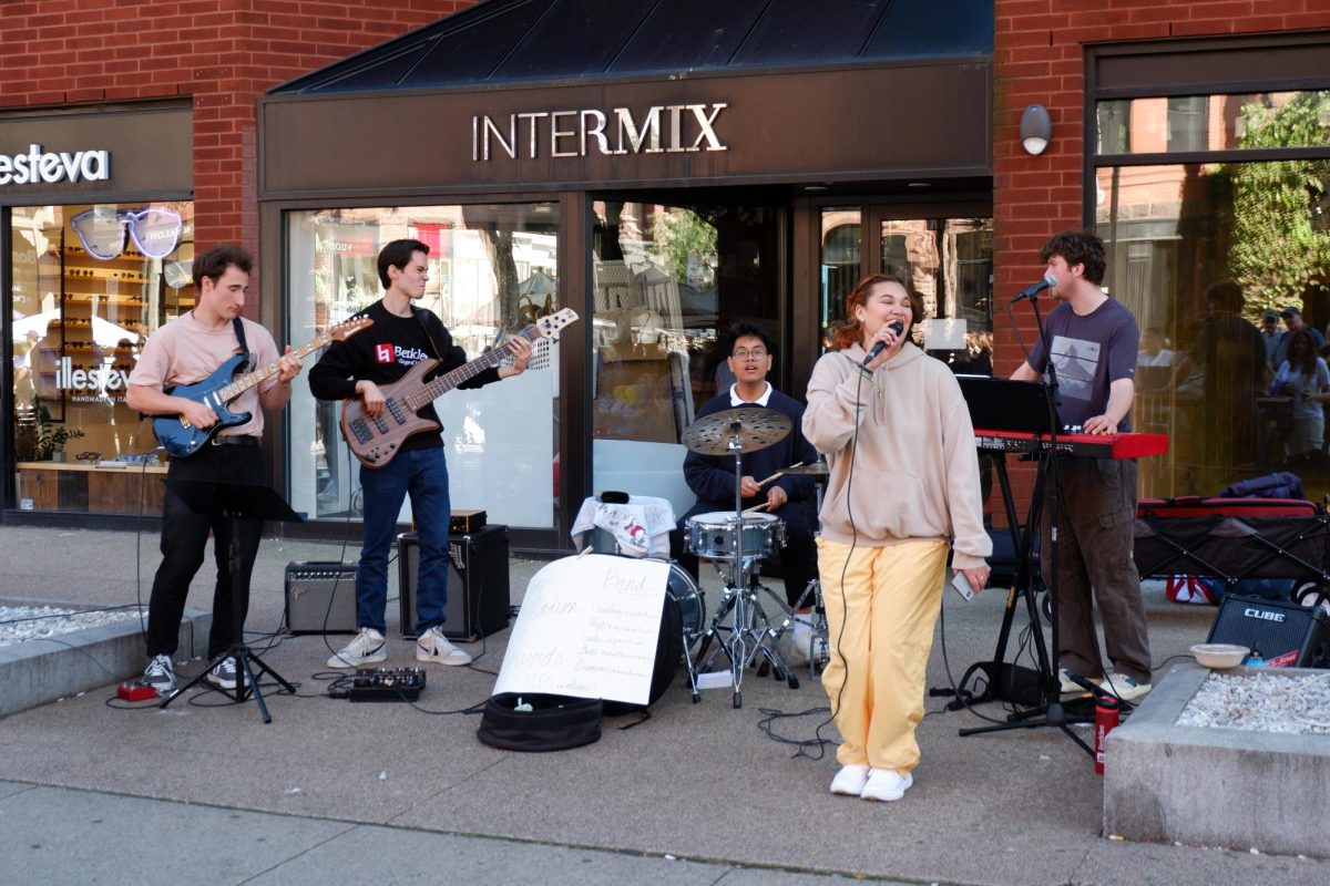 Berklee student band Joey and Friends entertain passersby by singing pop hits, including Bruno Mars’ “Treasure.” The band was one of many student groups using the event as an opportunity to show off their talent and raise money.