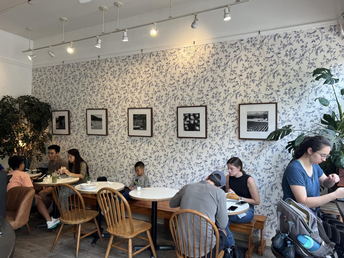 Customers enjoy drinks and food in Phinista. The French Vietnamese cafe has created a comfortable sit-down environment where many people choose to catch up with friends and family.