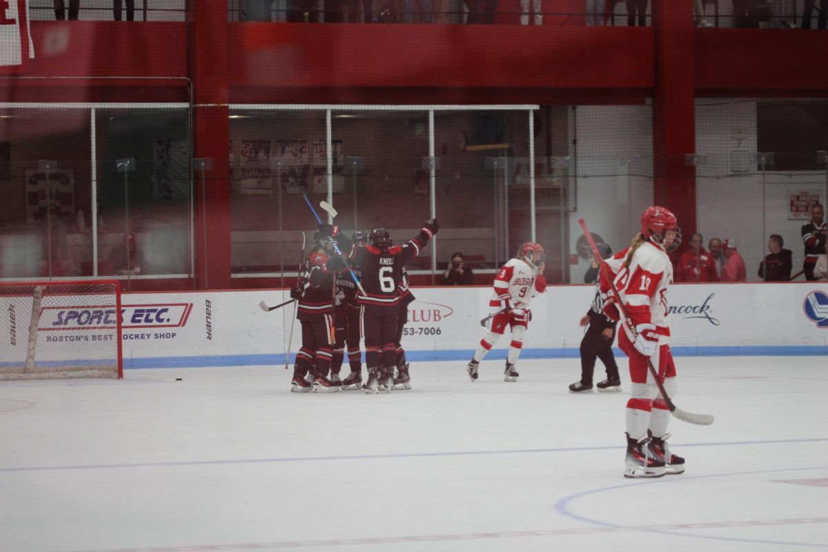The Huskies erupt after scoring a goal in their game against Boston University Friday evening. The matchup was Northeasterns first conference game of the season.