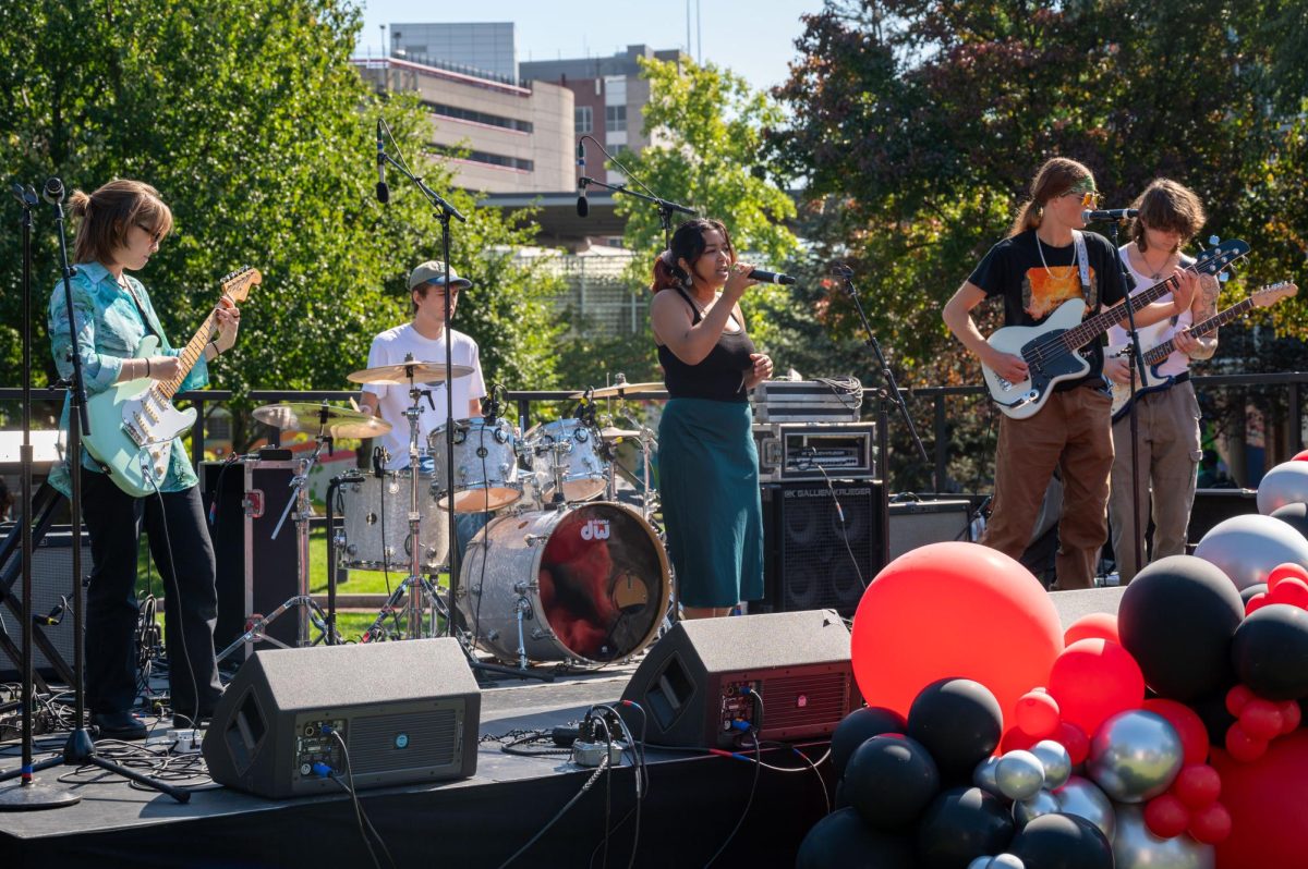 The student group Vi performs on Centennial Common. Around noon, students listened to three student performers.